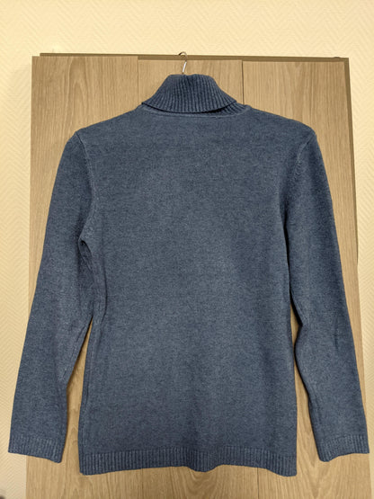 Close-up of the blue turtleneck sweater's collar