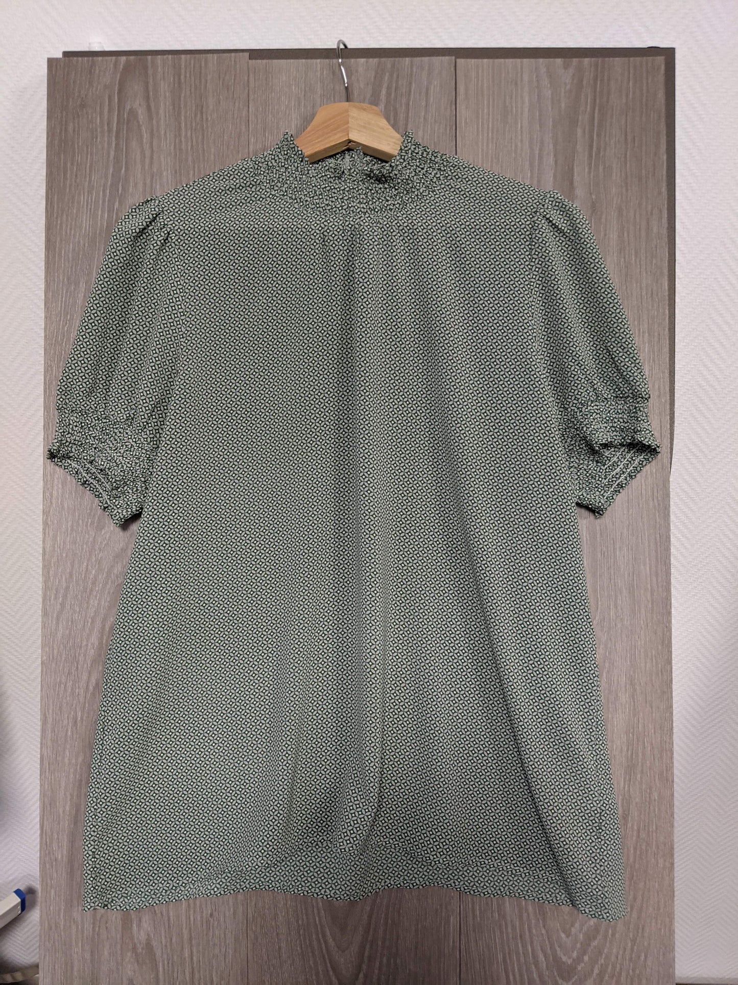 Front view of the green printed blouse