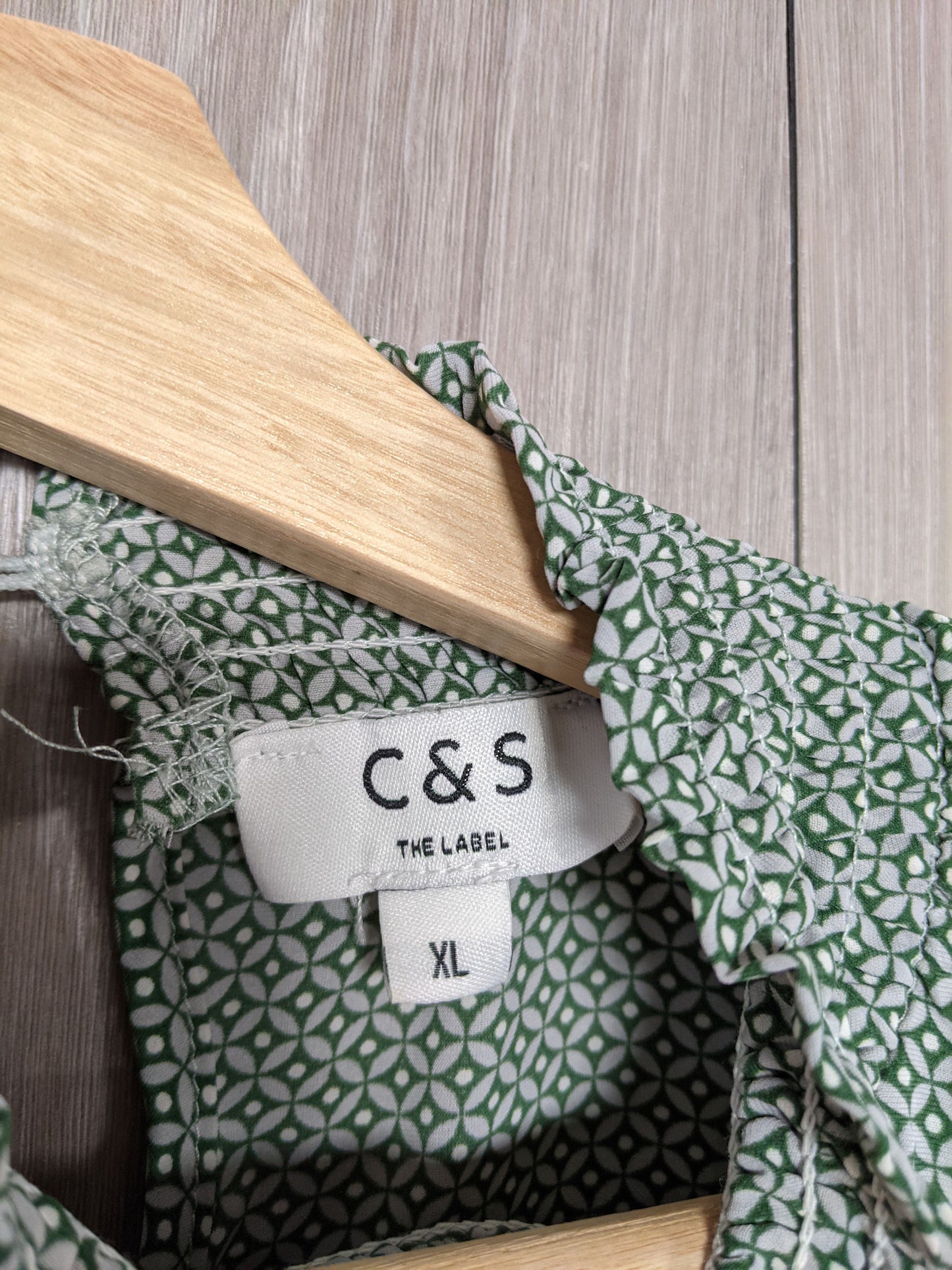 Tag showing size XL of the blouse