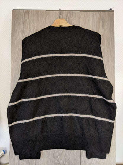 Back view of a black striped sweater