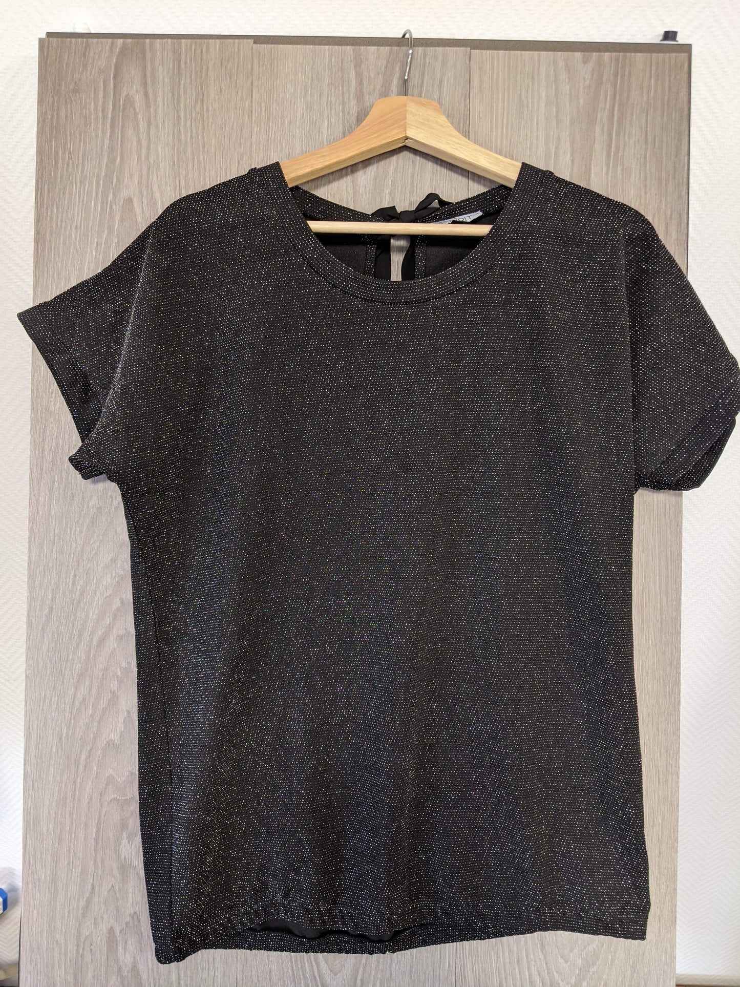 Front view of the sparkly black top