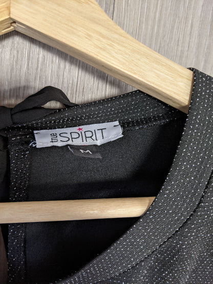 Close-up of the label on the sparkly black top