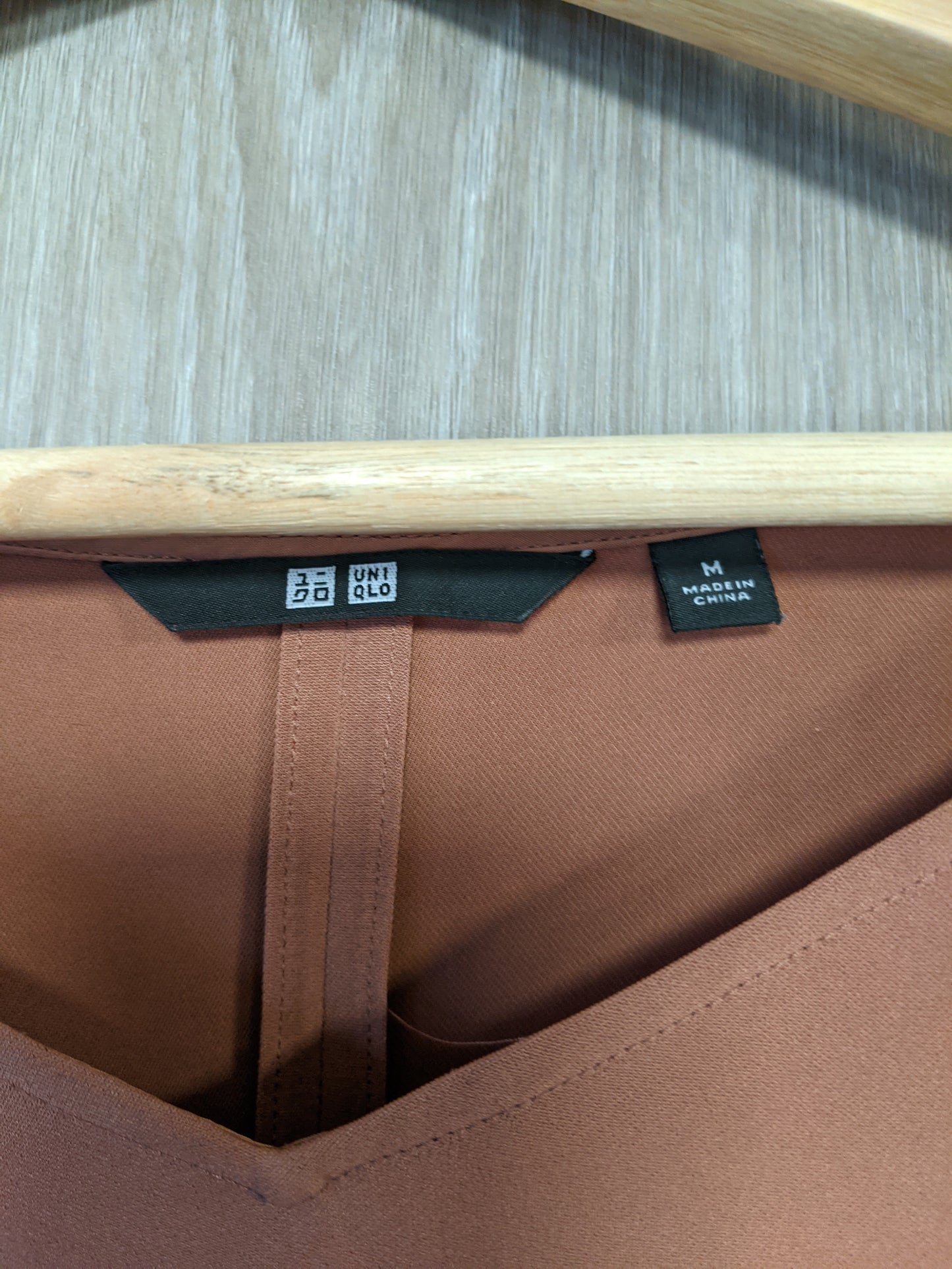 Brown V-neck top label