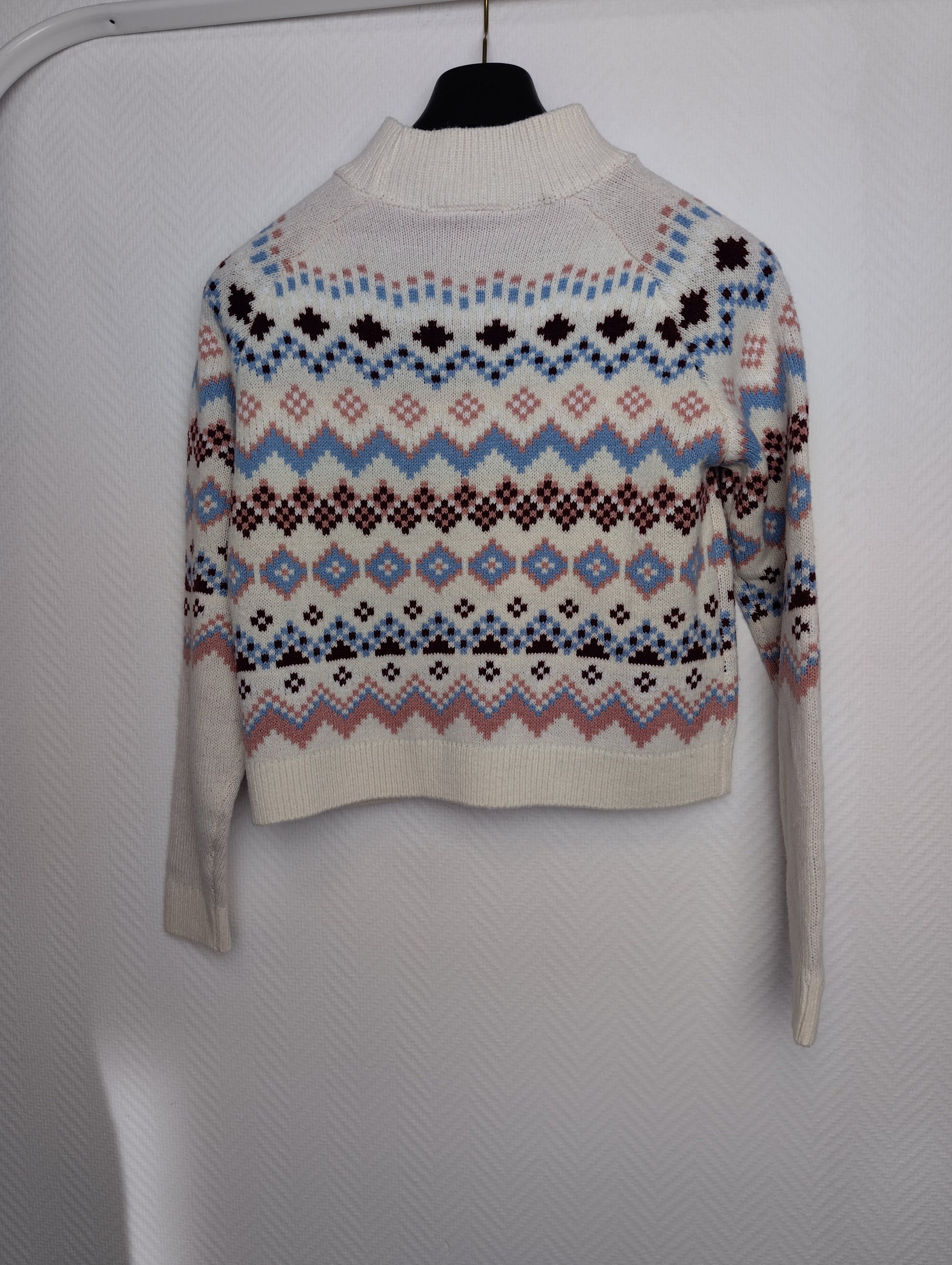 Back view of a patterned sweater