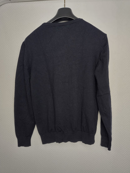 Back view of black sweater on hanger