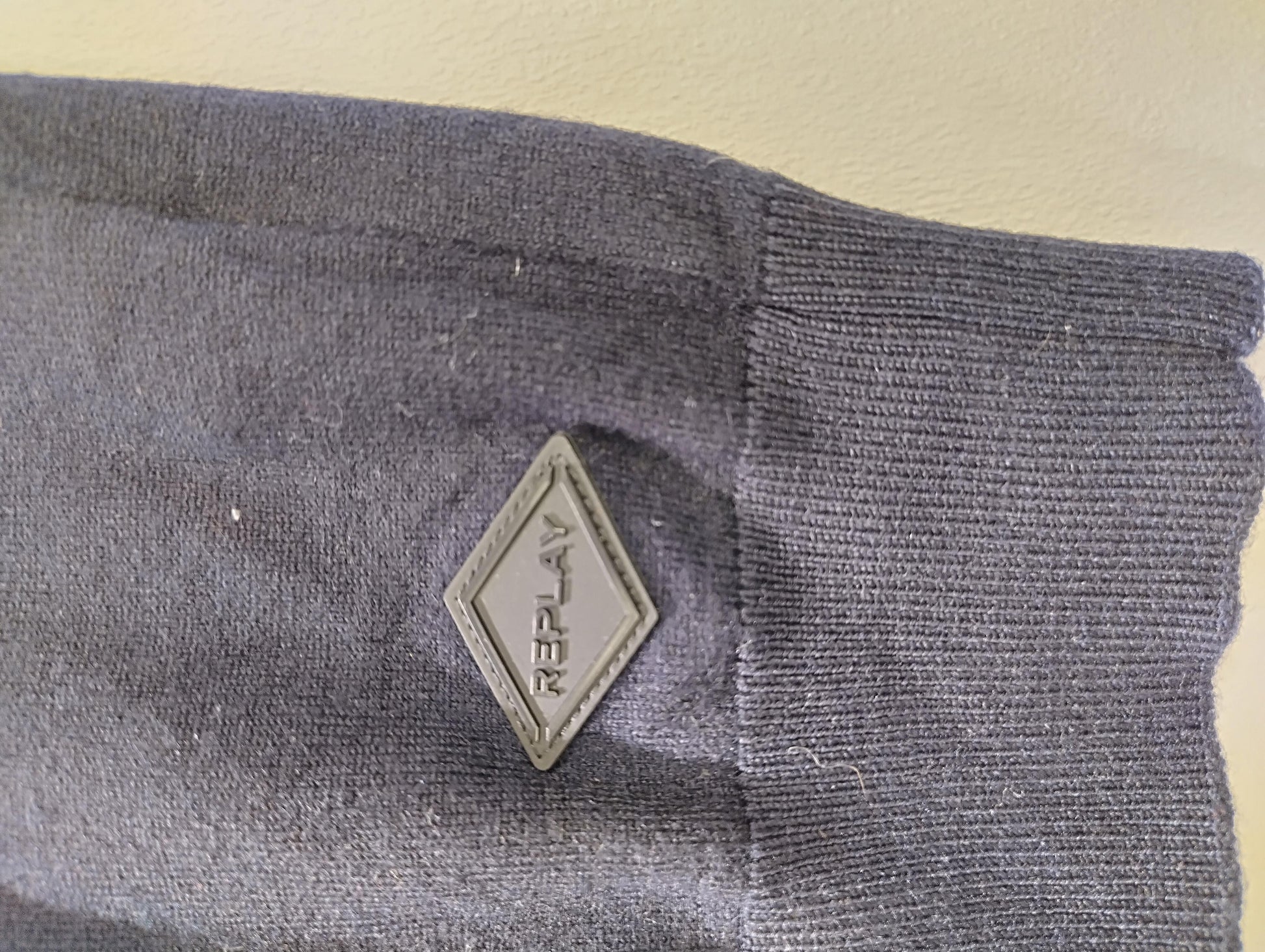 Close-up of another side of the sweater logo