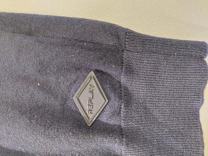 Close-up of another side of the sweater logo