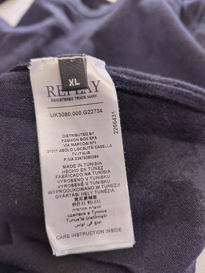 Close-up of sweater label with size information