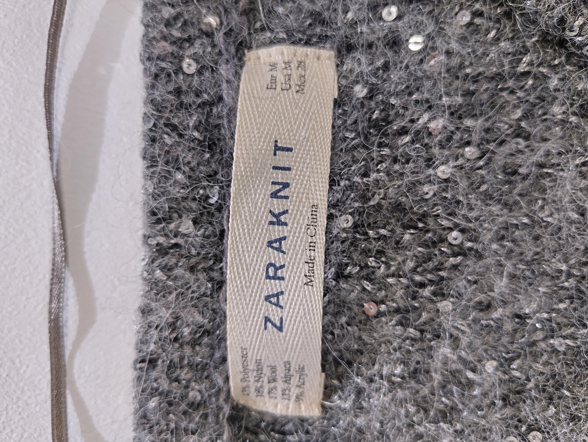 Close-up of Zaraknit label and fabric