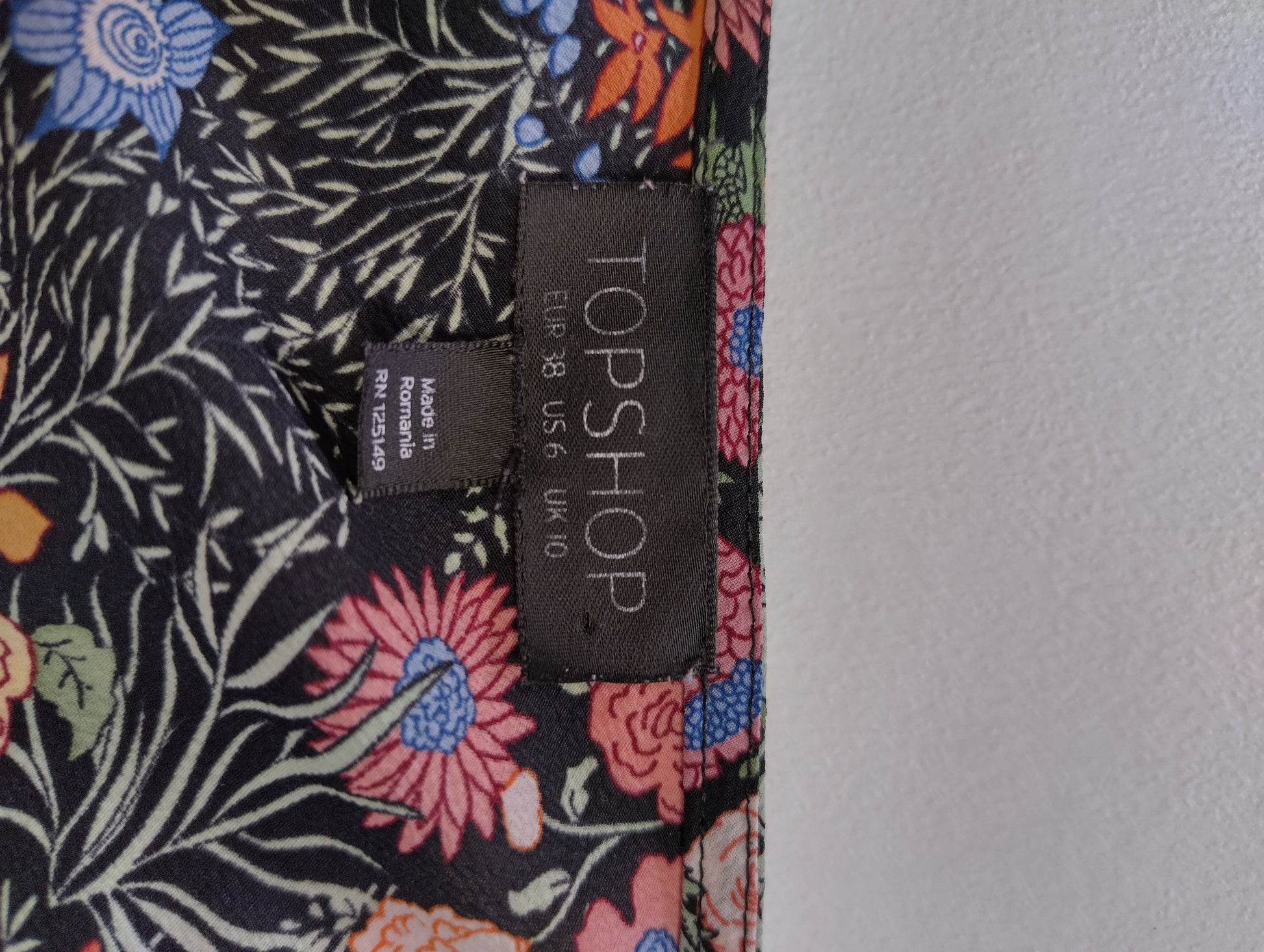 Tag showing Topshop brand and size