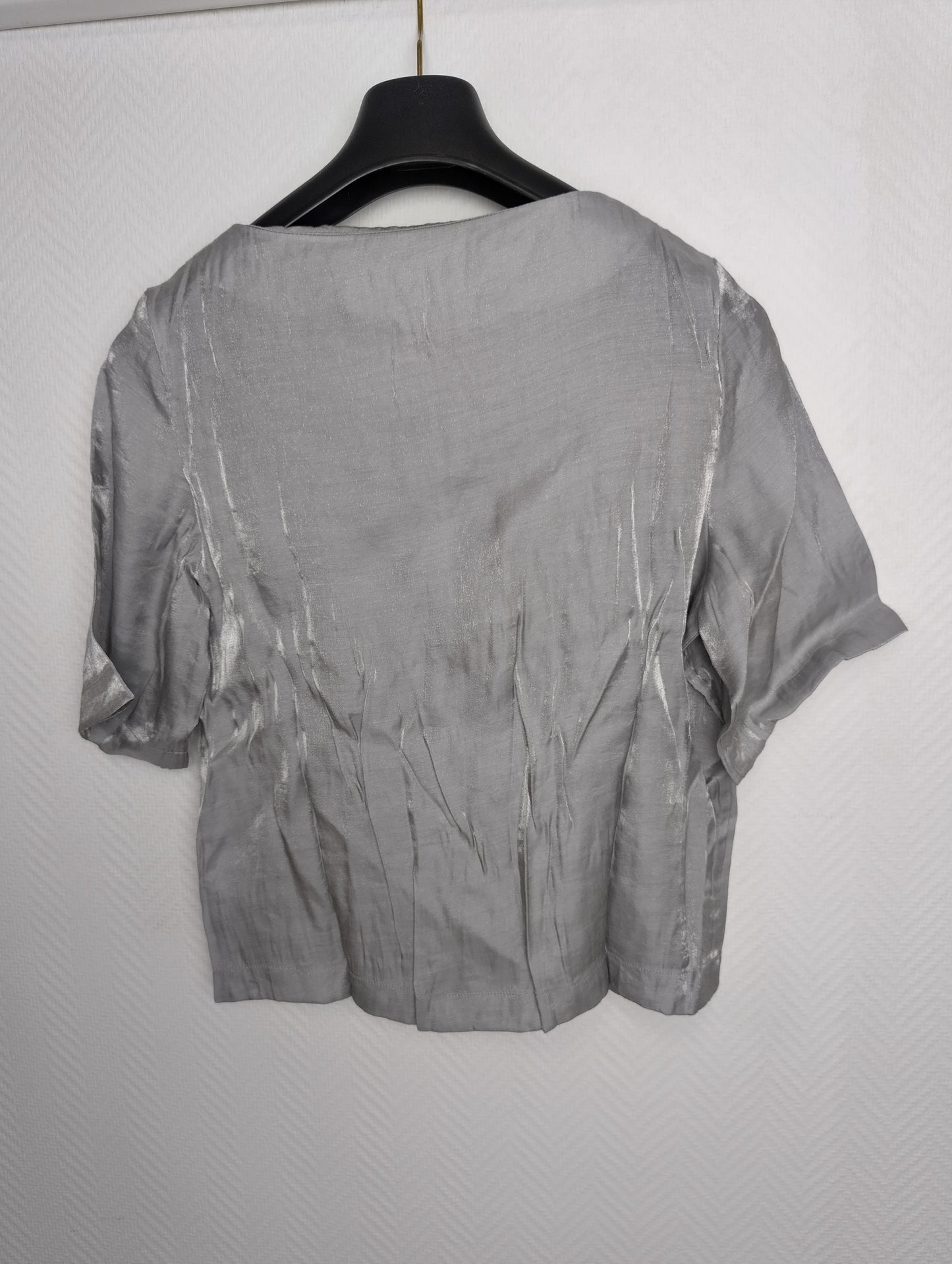 Side view of grey short sleeve top