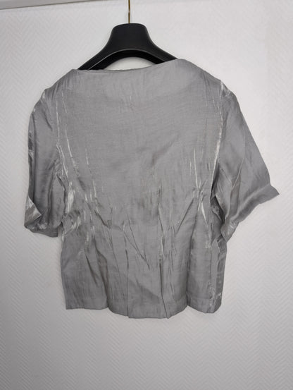 Side view of grey short sleeve top