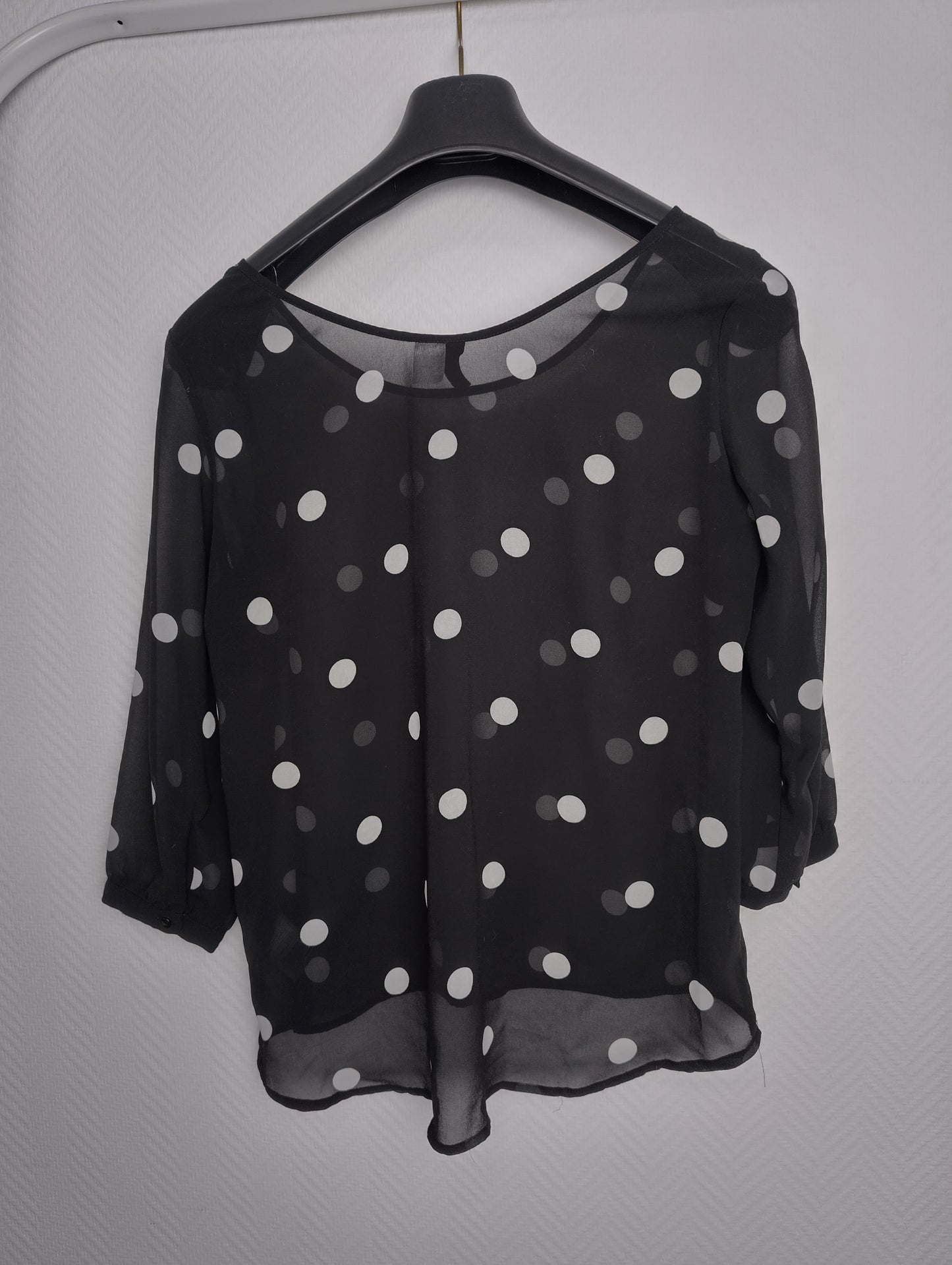 Black polka dot blouse back view