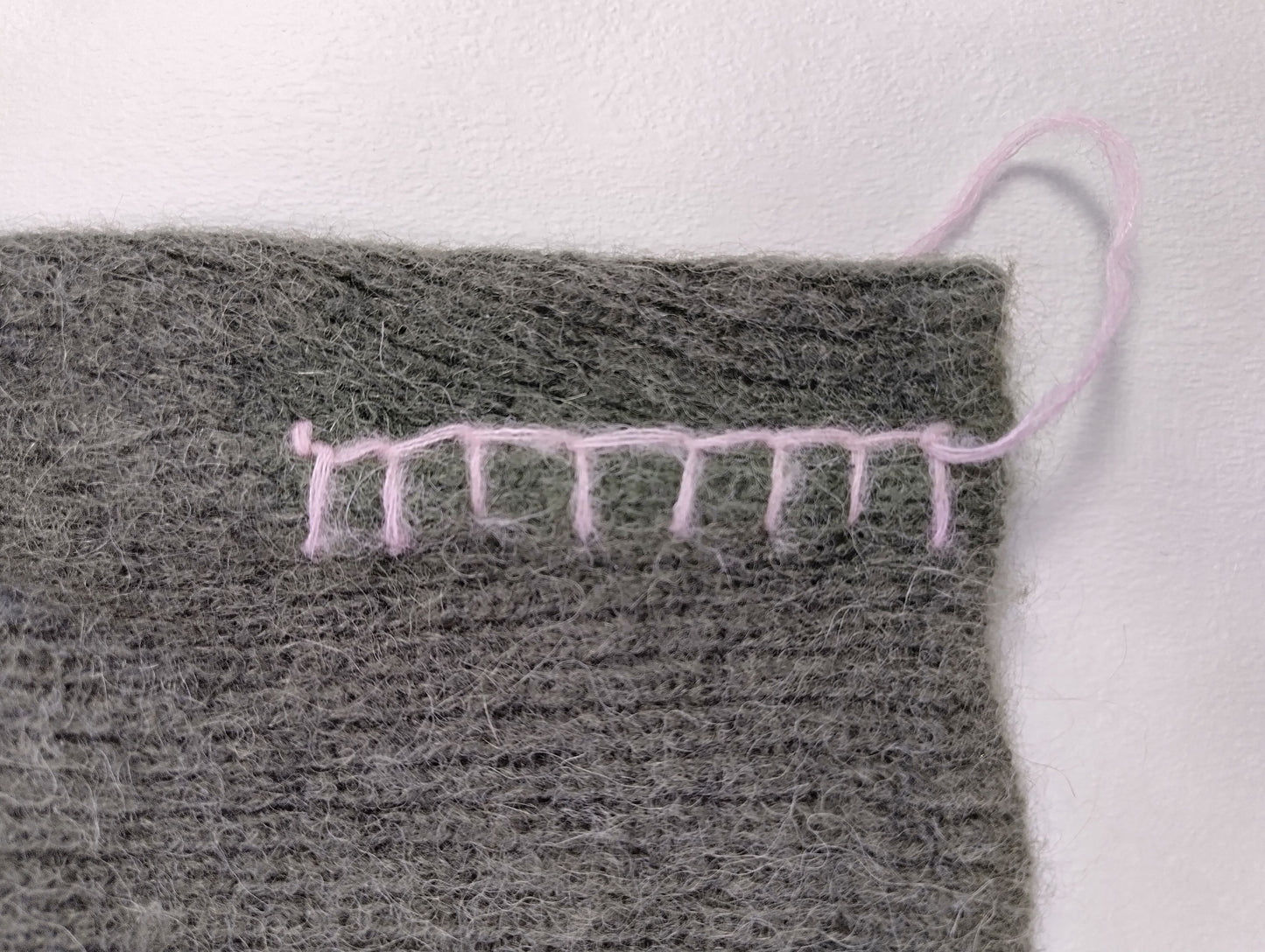 Close-up of seam detail on sweater