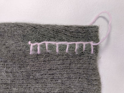 Close-up of seam detail on sweater