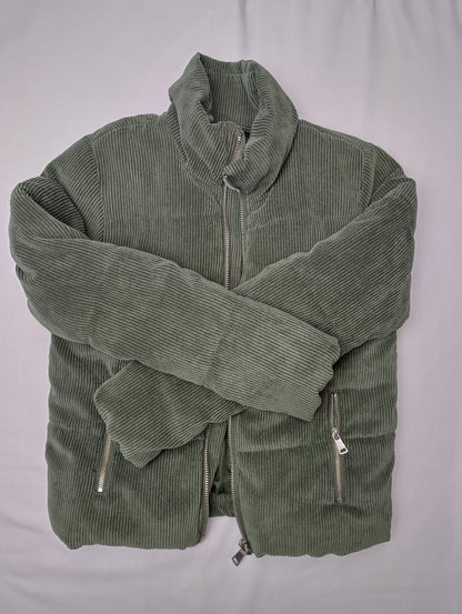 Folded olive green corduroy jacket