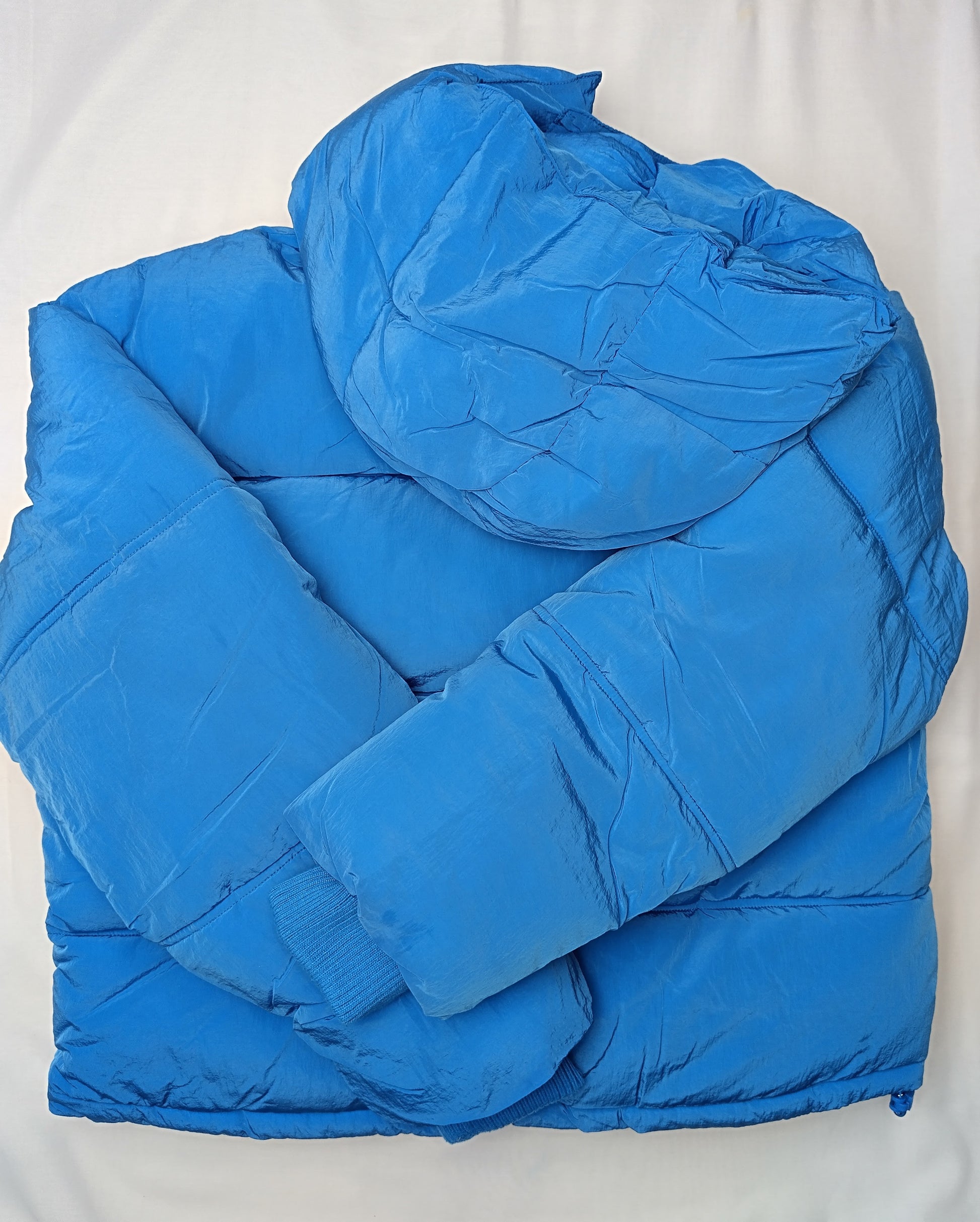 Back view of blue puffer jacket