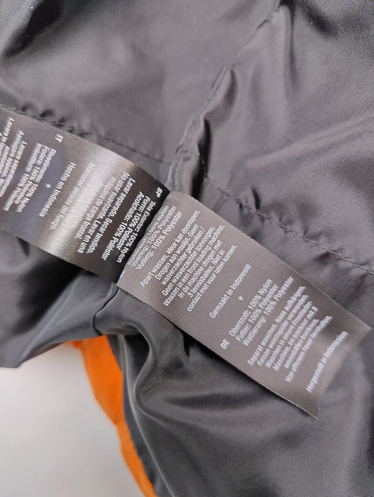 Snow pants care label and fabric composition