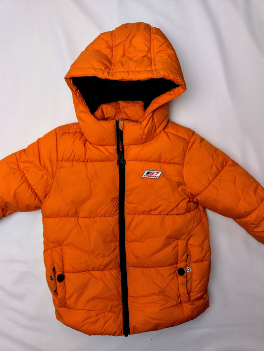 Front view of bright orange puffer jacket