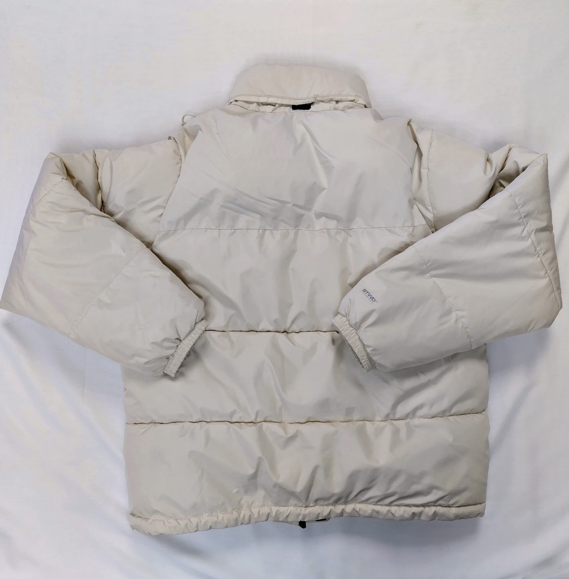 Back view of cream puffer jacket
