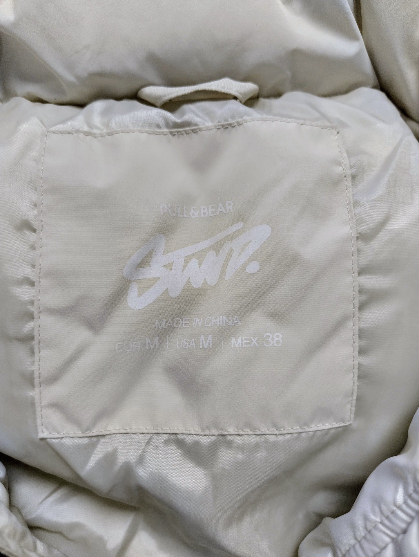 Size label of Pull&Bear puffer jacket