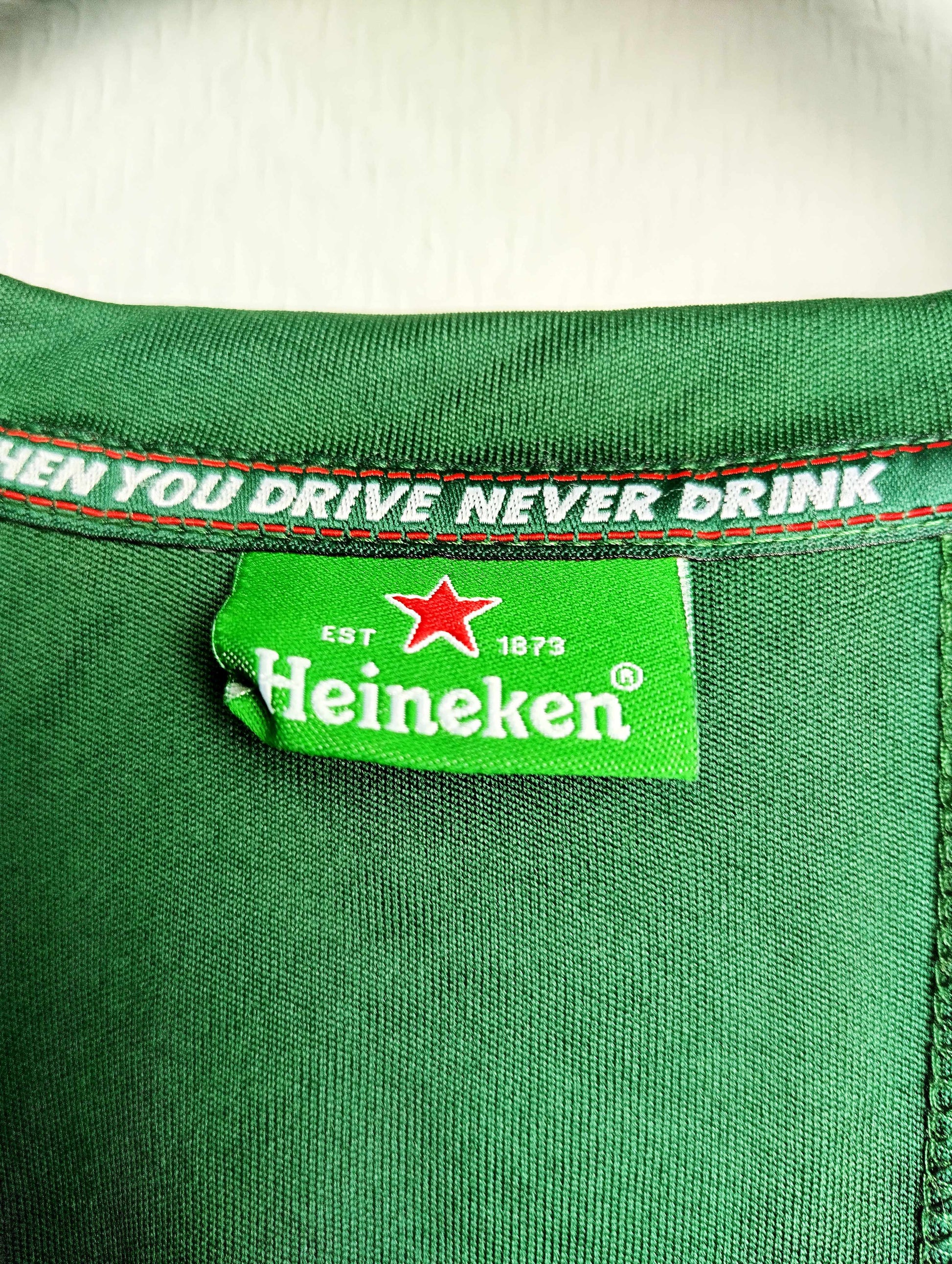 Label with Heineken slogan on t-shirt
