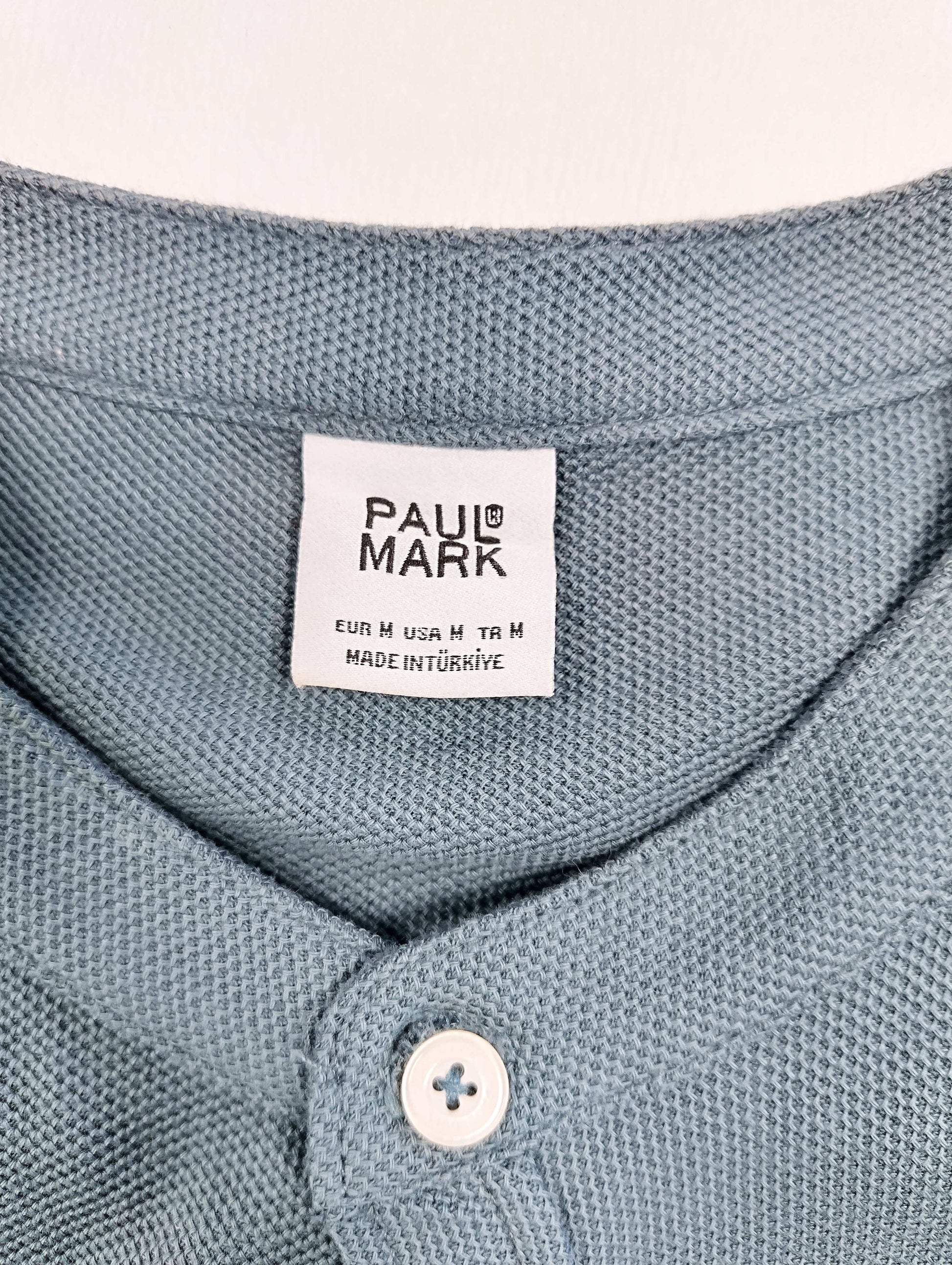 Close-up of the shirt's collar and label