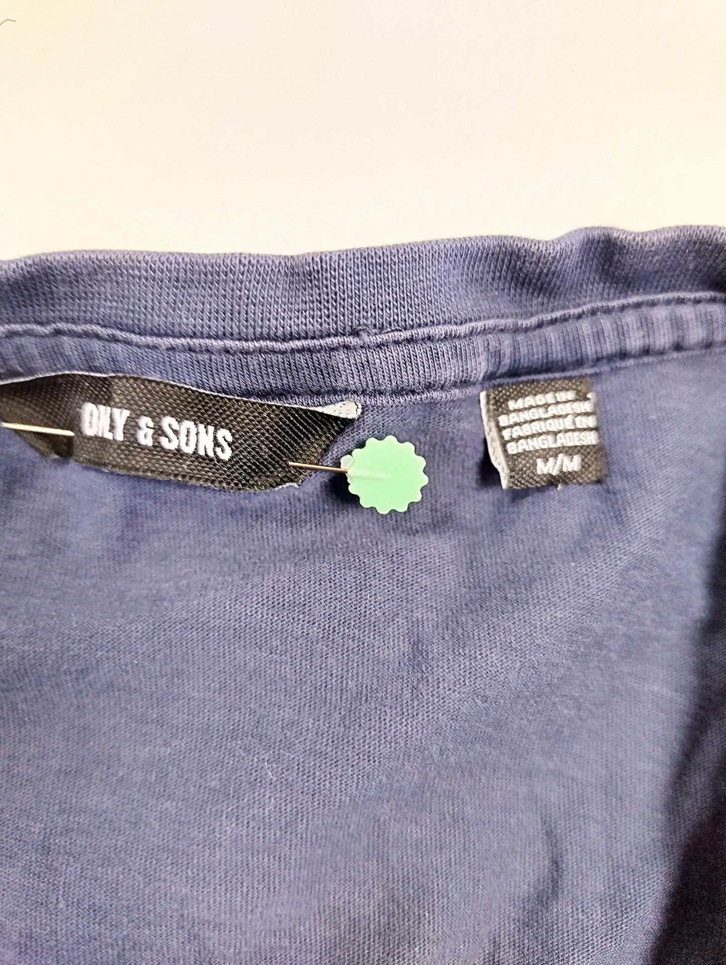 Close-up of the label and tag on the t-shirt