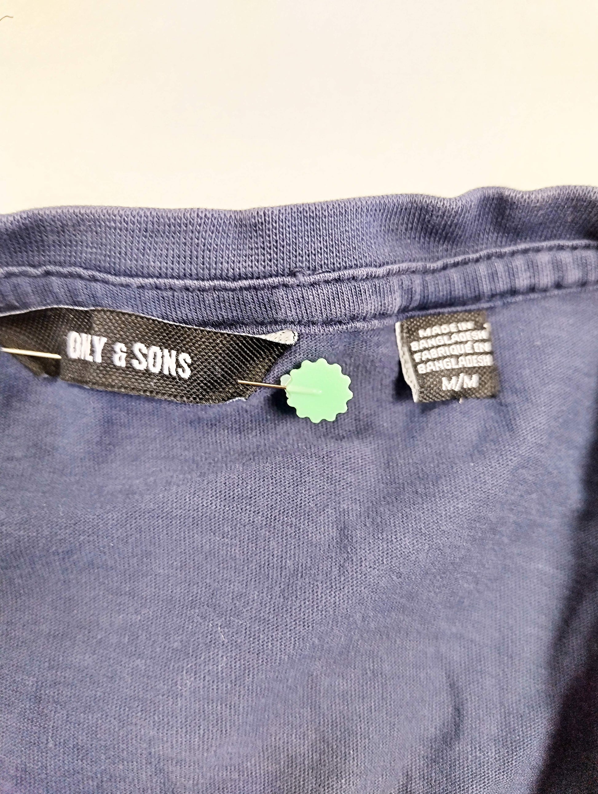 Close-up of the label and tag on the t-shirt