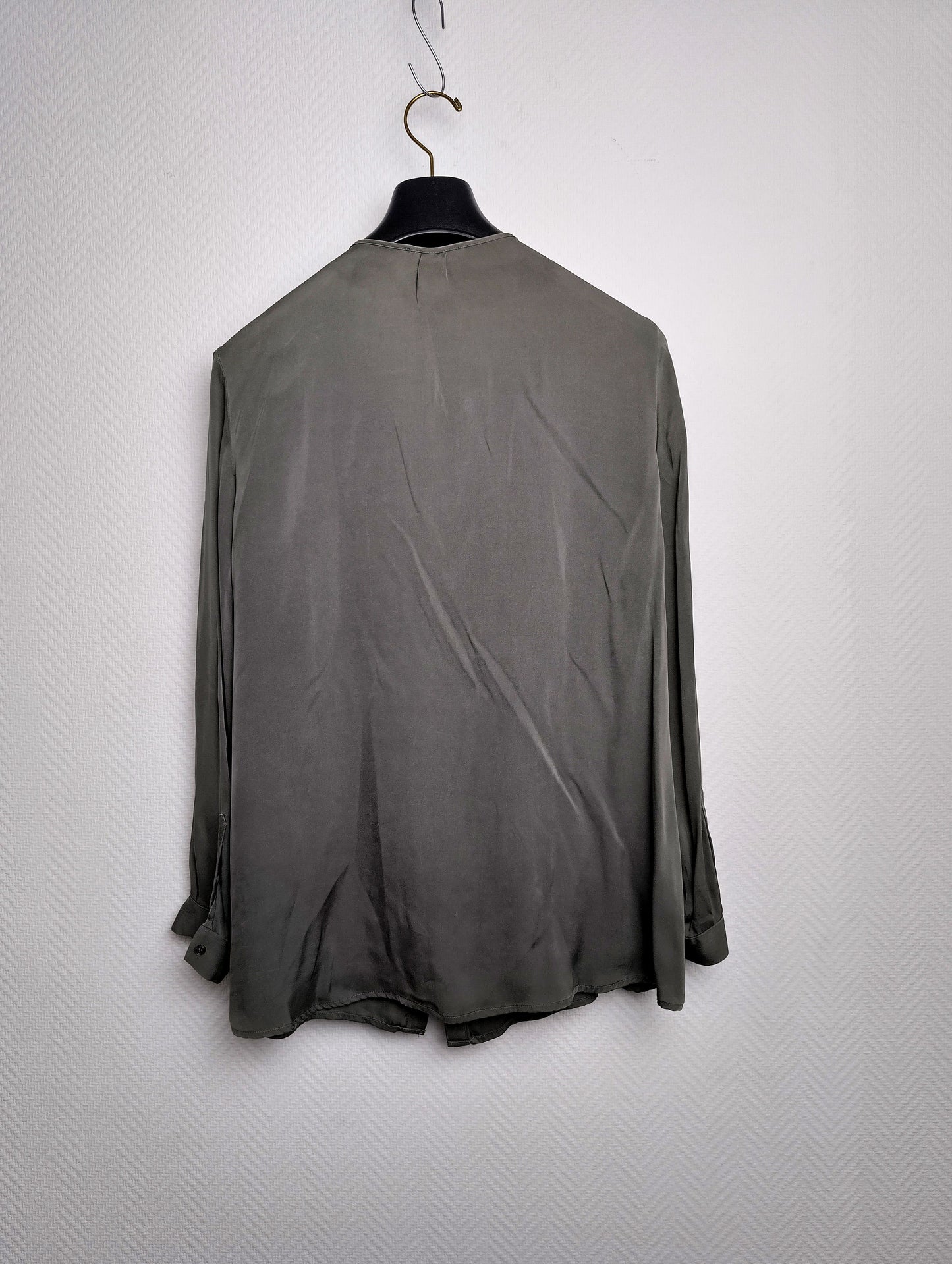 Back view of the olive green shirt