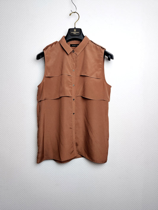 Front view of brown sleeveless blouse