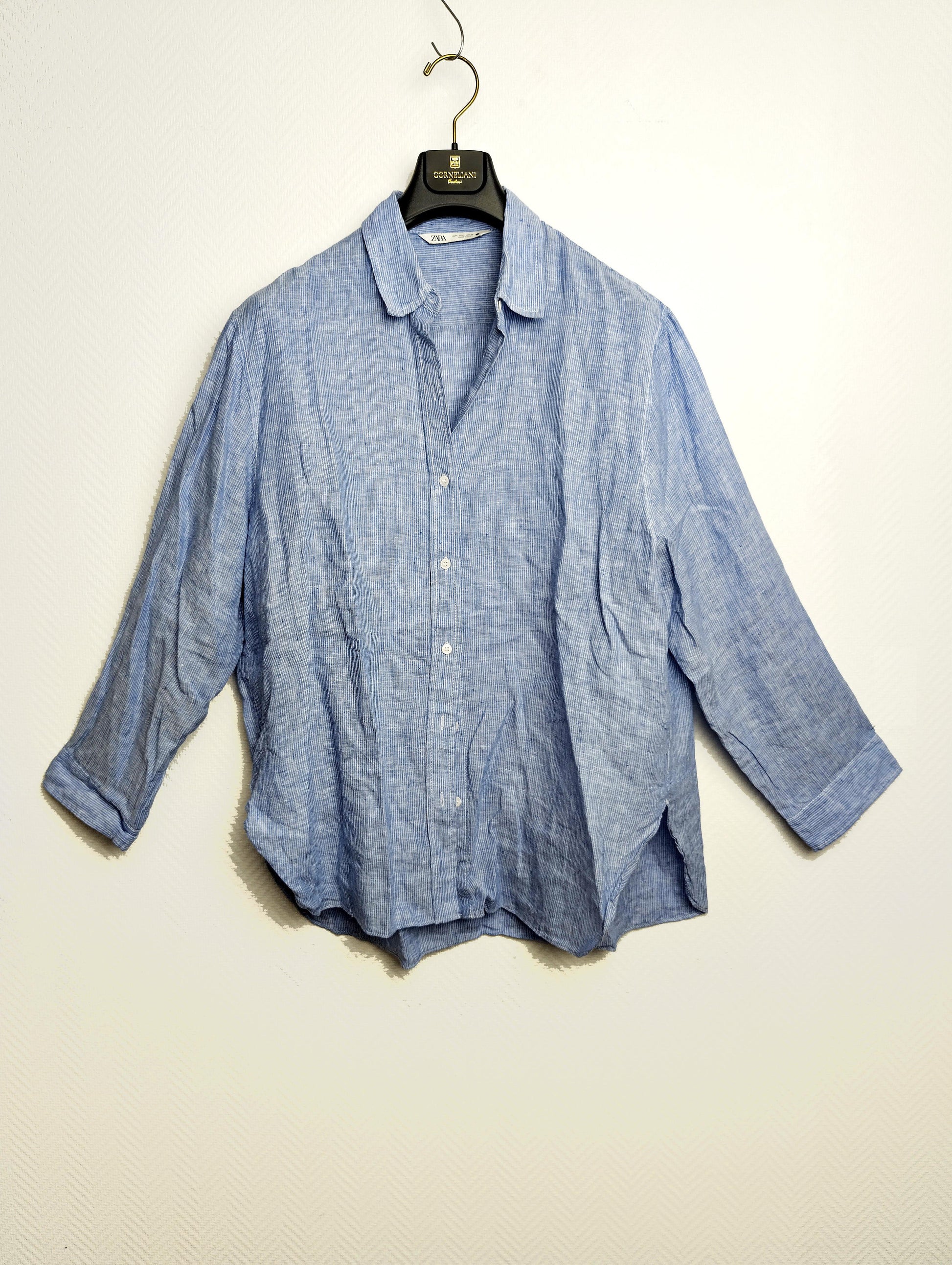 Front view of Zara light blue linen shirt