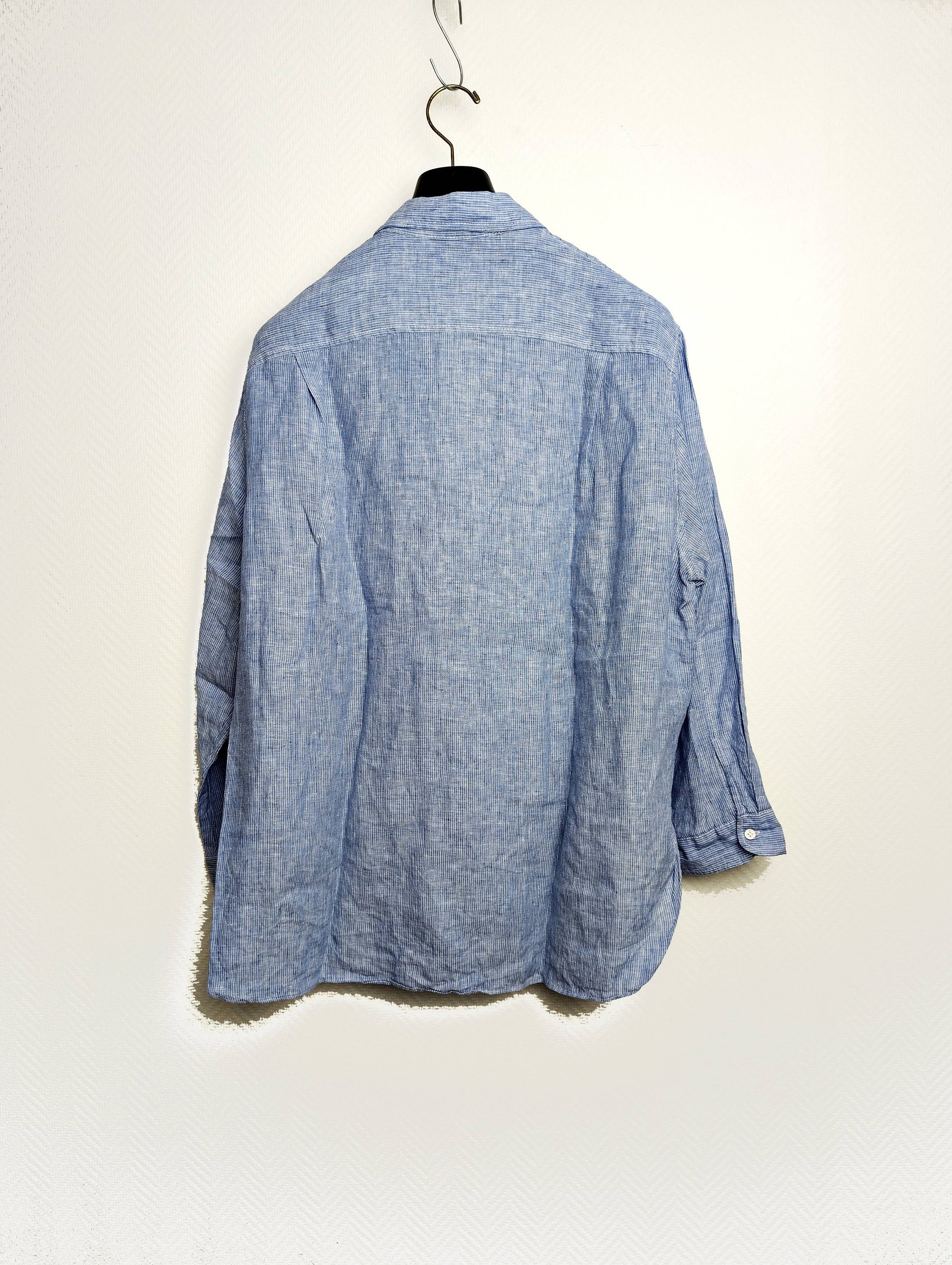 Back view of Zara light blue linen shirt