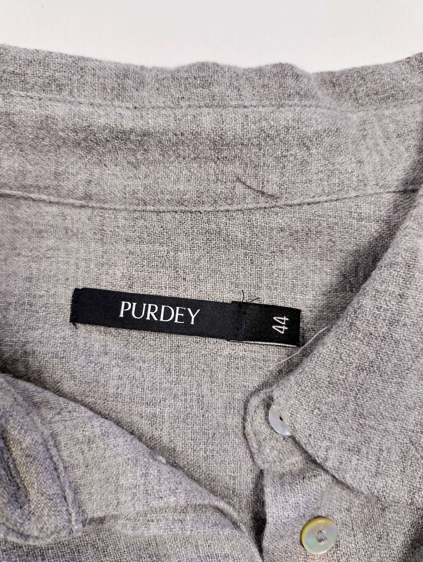 Close-up of label showing size and brand