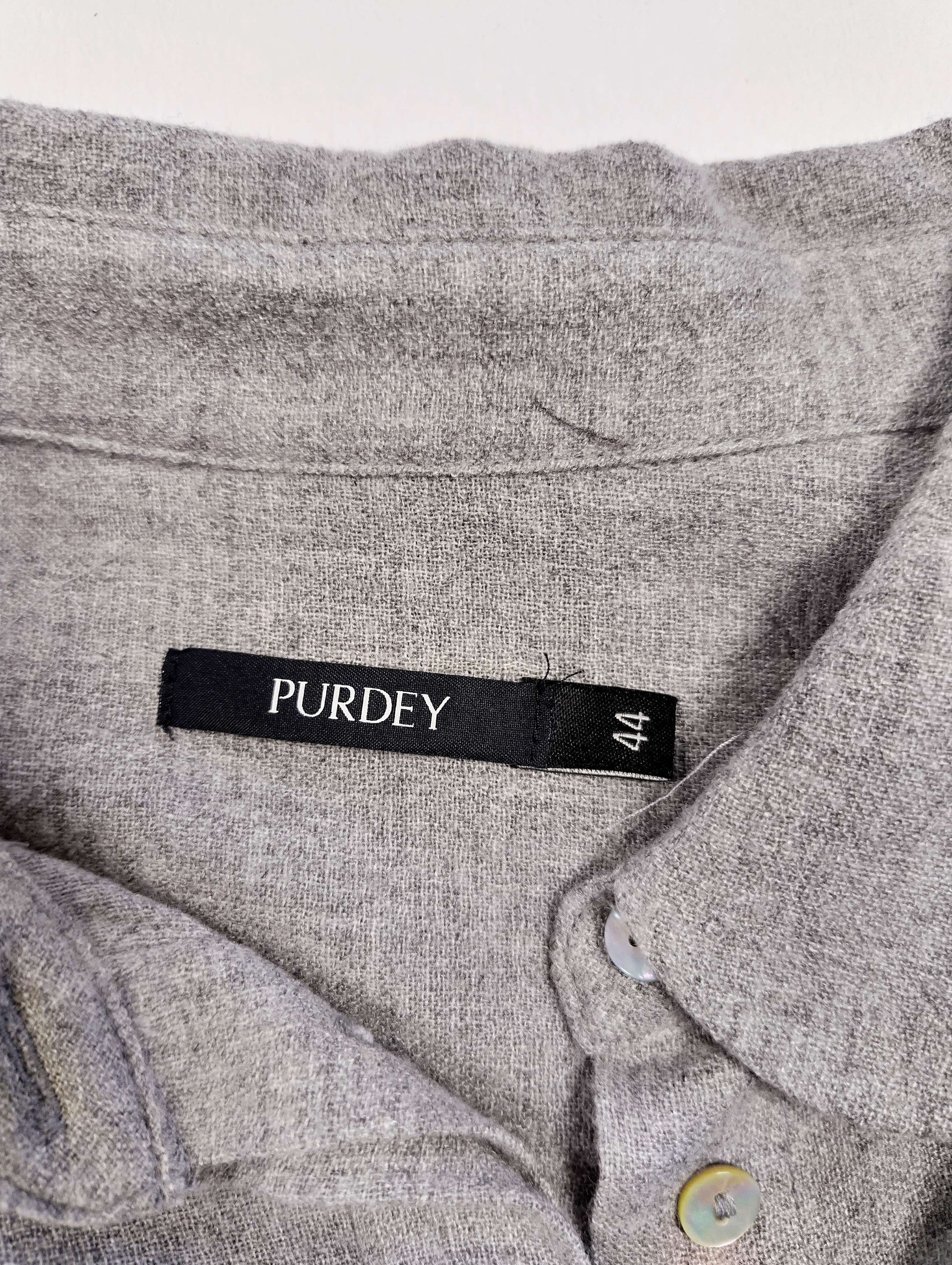 Close-up of label showing size and brand