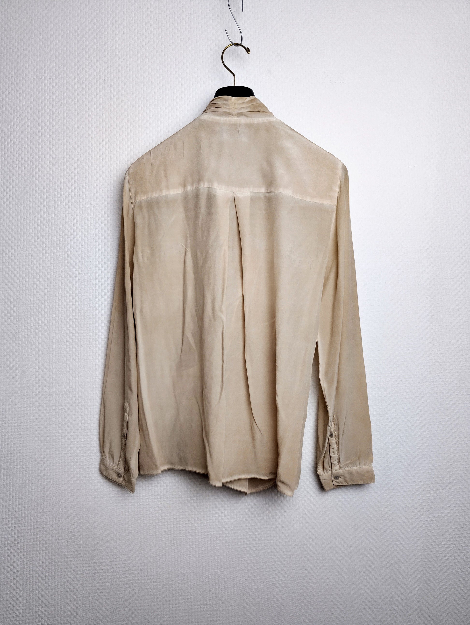 Back view of beige blouse