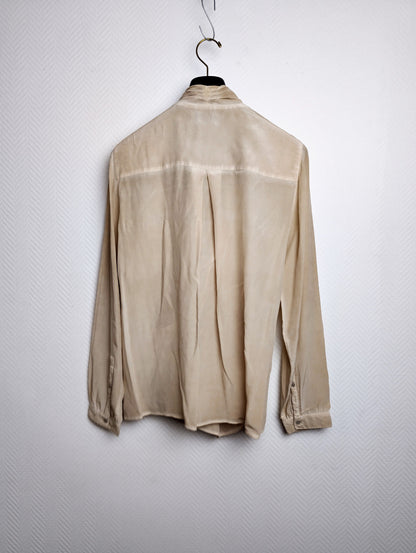 Back view of beige blouse