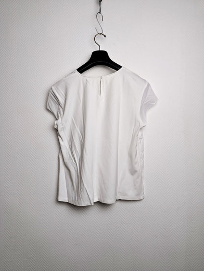Front view of the white embroidered blouse