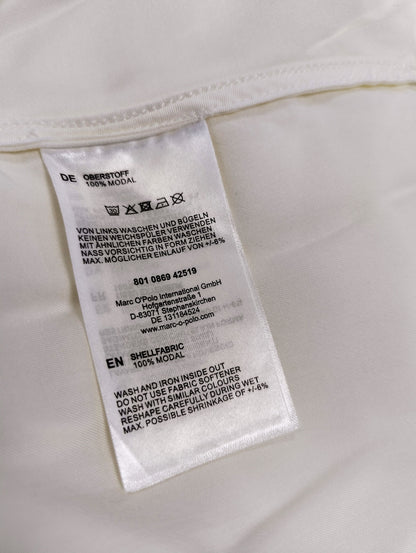 Care instructions and fabric details of the blouse