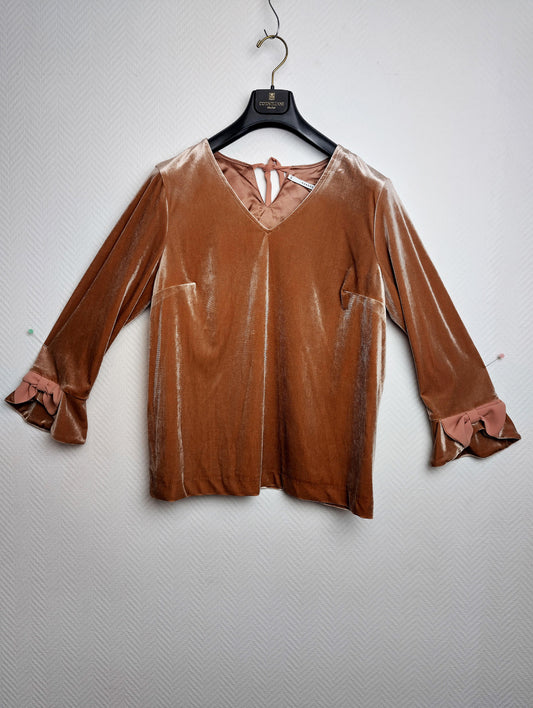 Front view of a velvet top with ruffled sleeves