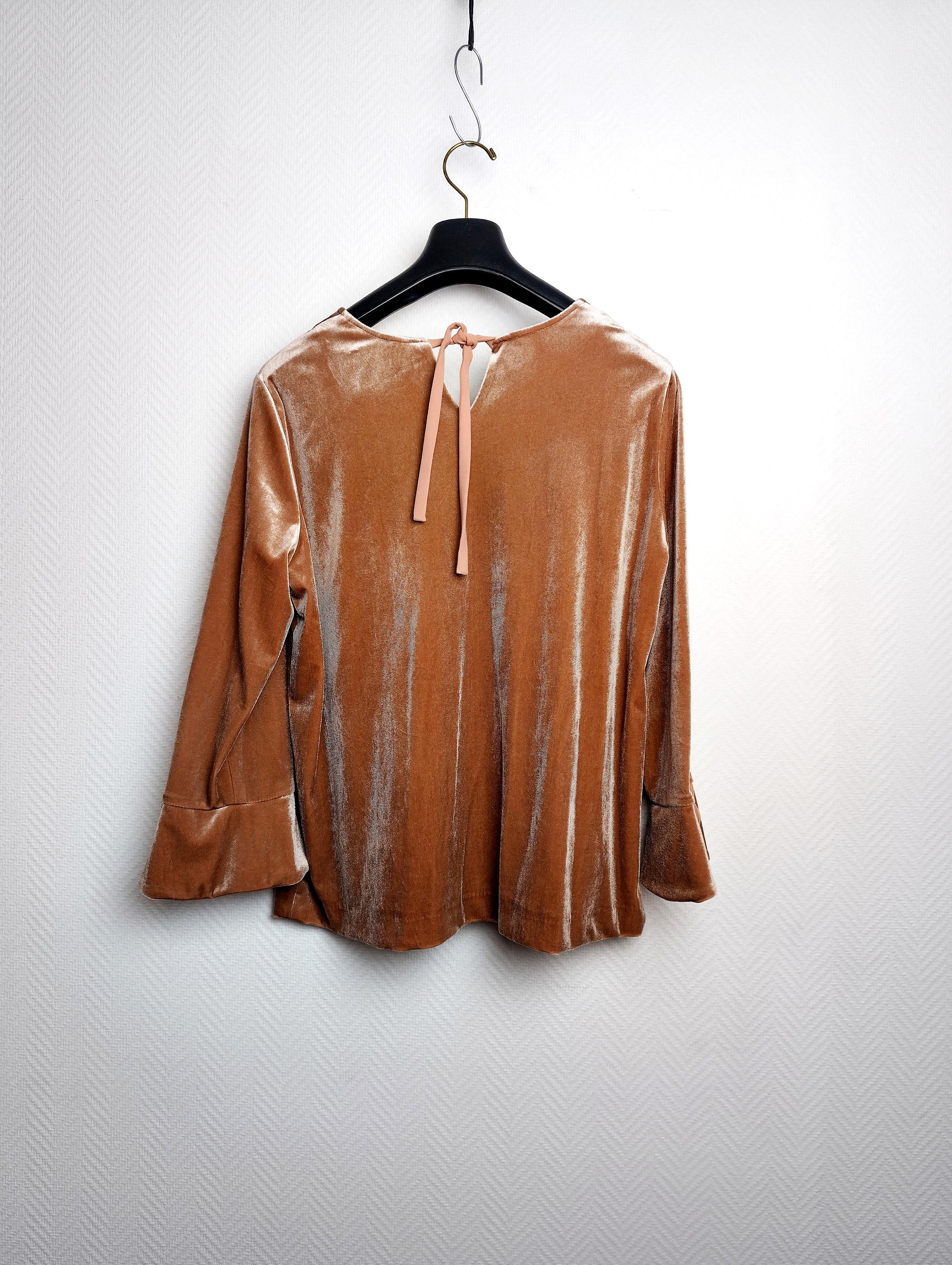 Back view of a velvet top with tie closure