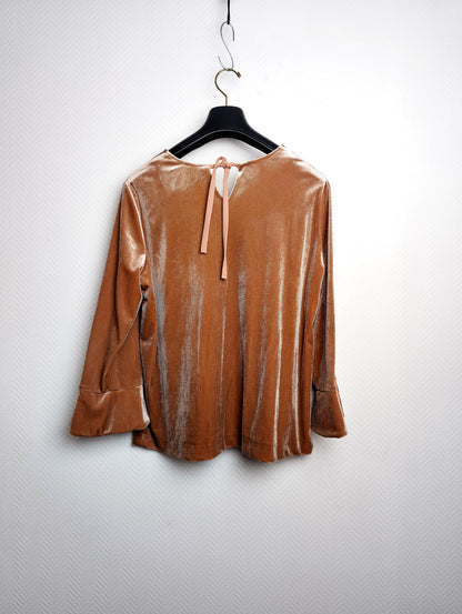 Back view of a velvet top with tie closure