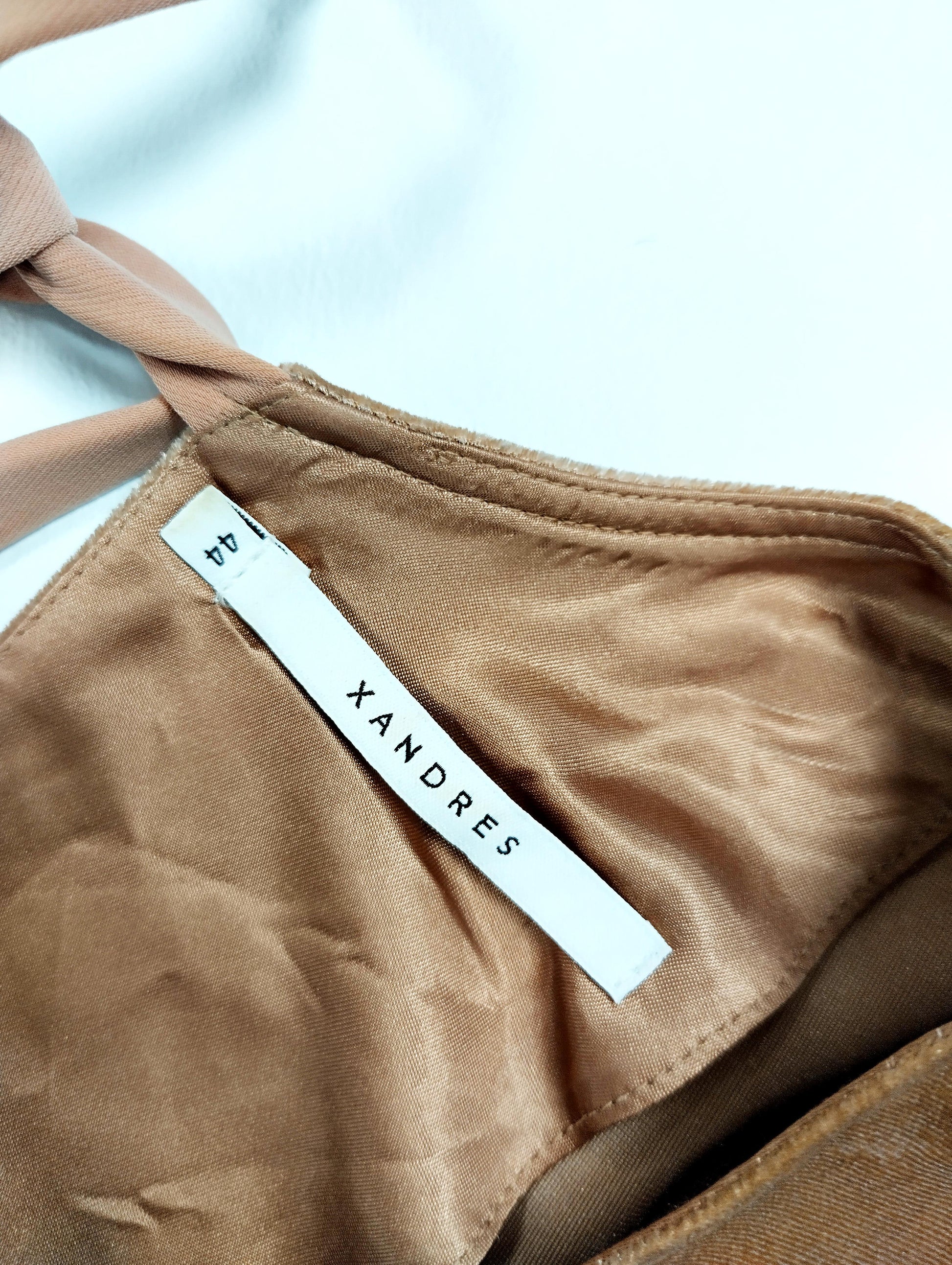 Label tag on the velvet top showing size and brand