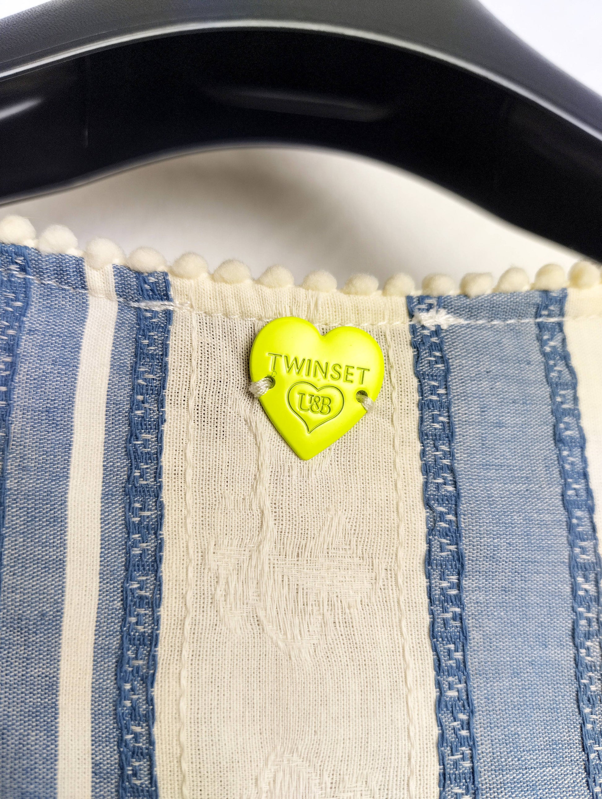 Close-up of the neck tag showing Twinset logo