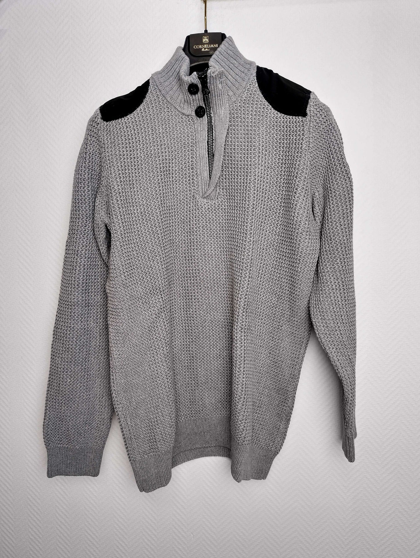 Front view of gray sweater with black shoulder accents