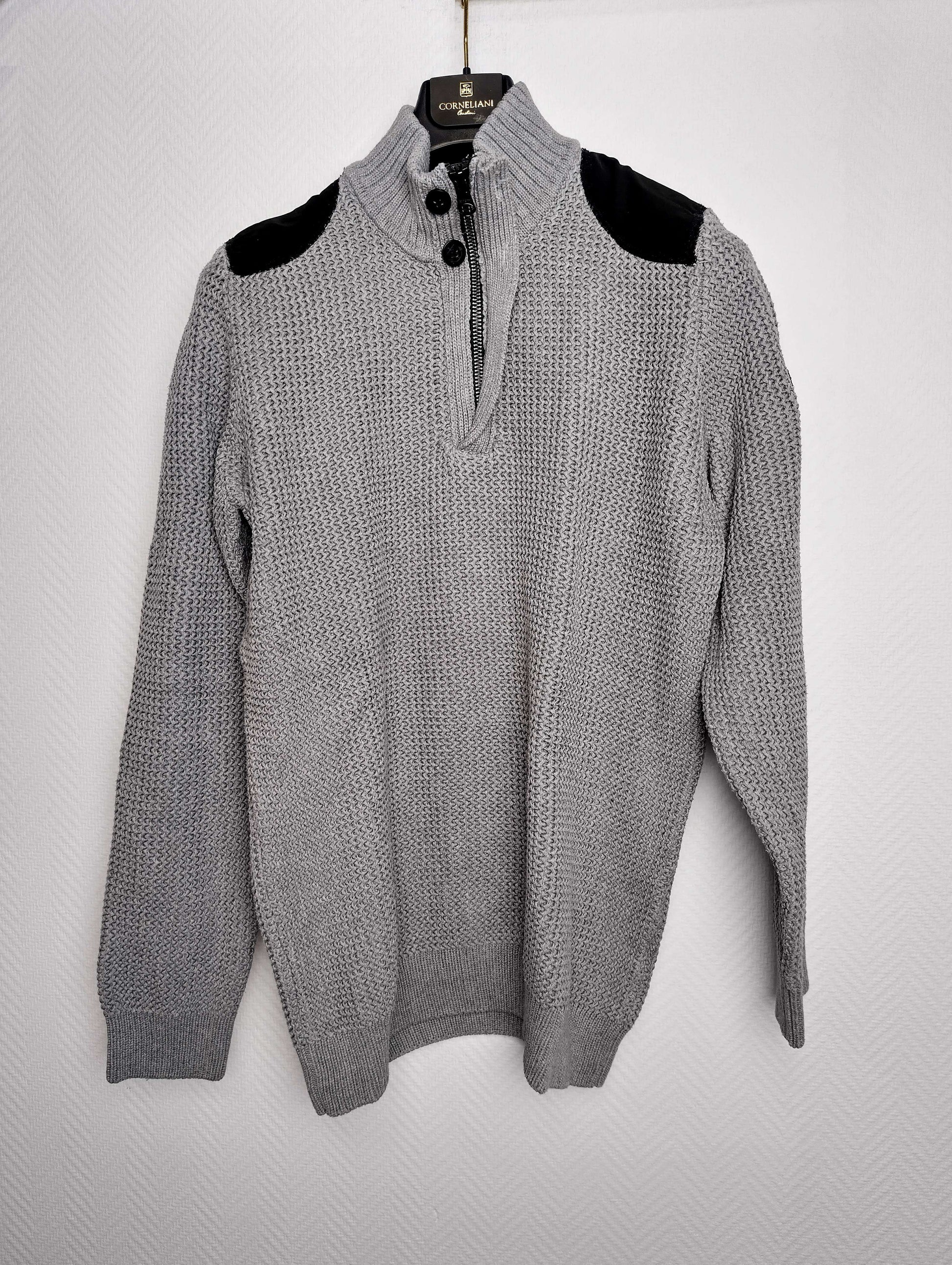 Front view of gray sweater with black shoulder accents