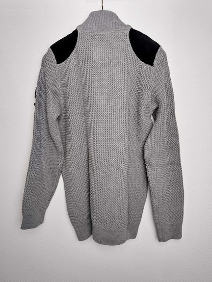 Back view of gray sweater with black shoulder accents