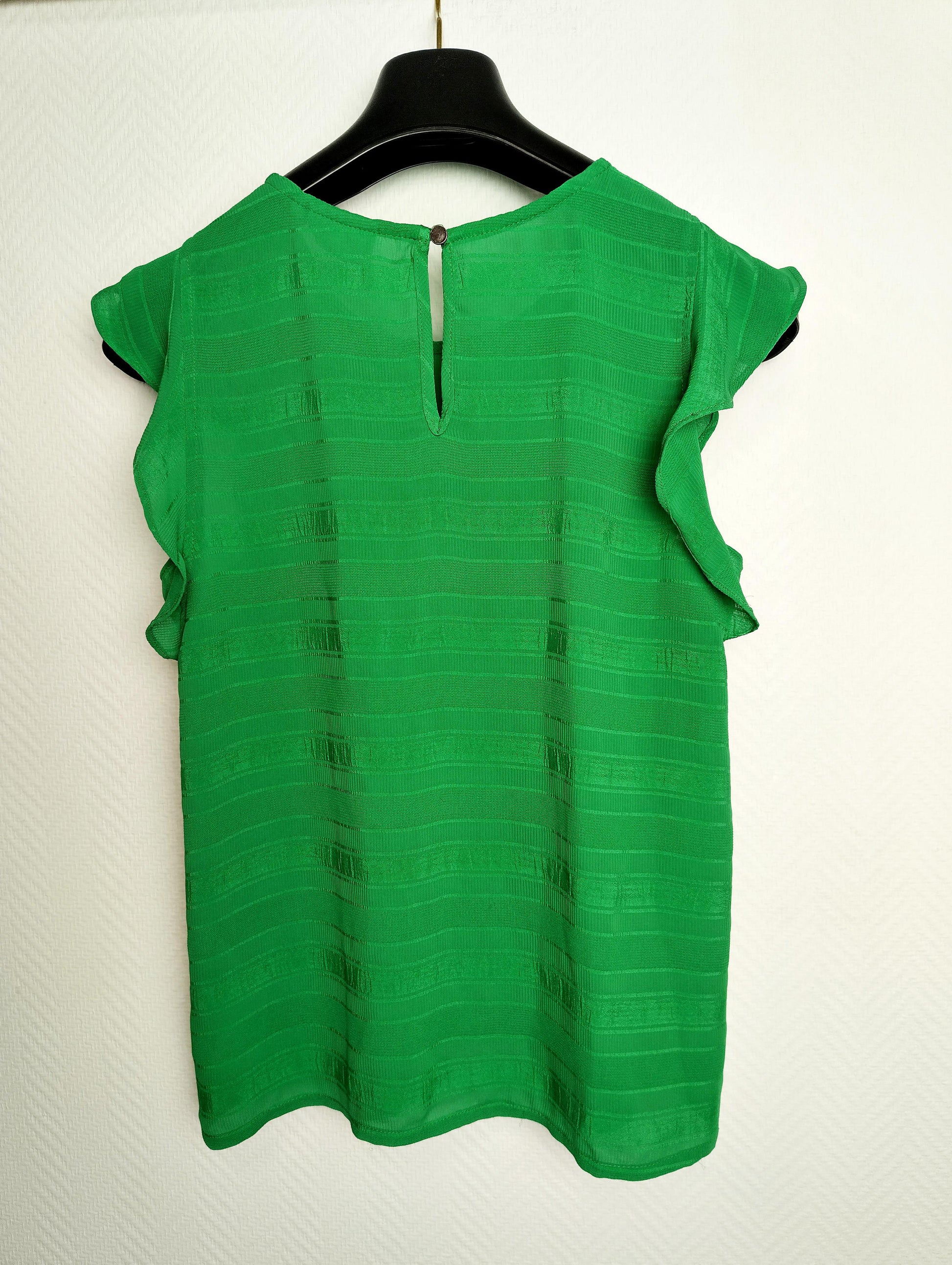 Back view of the green ruffled top