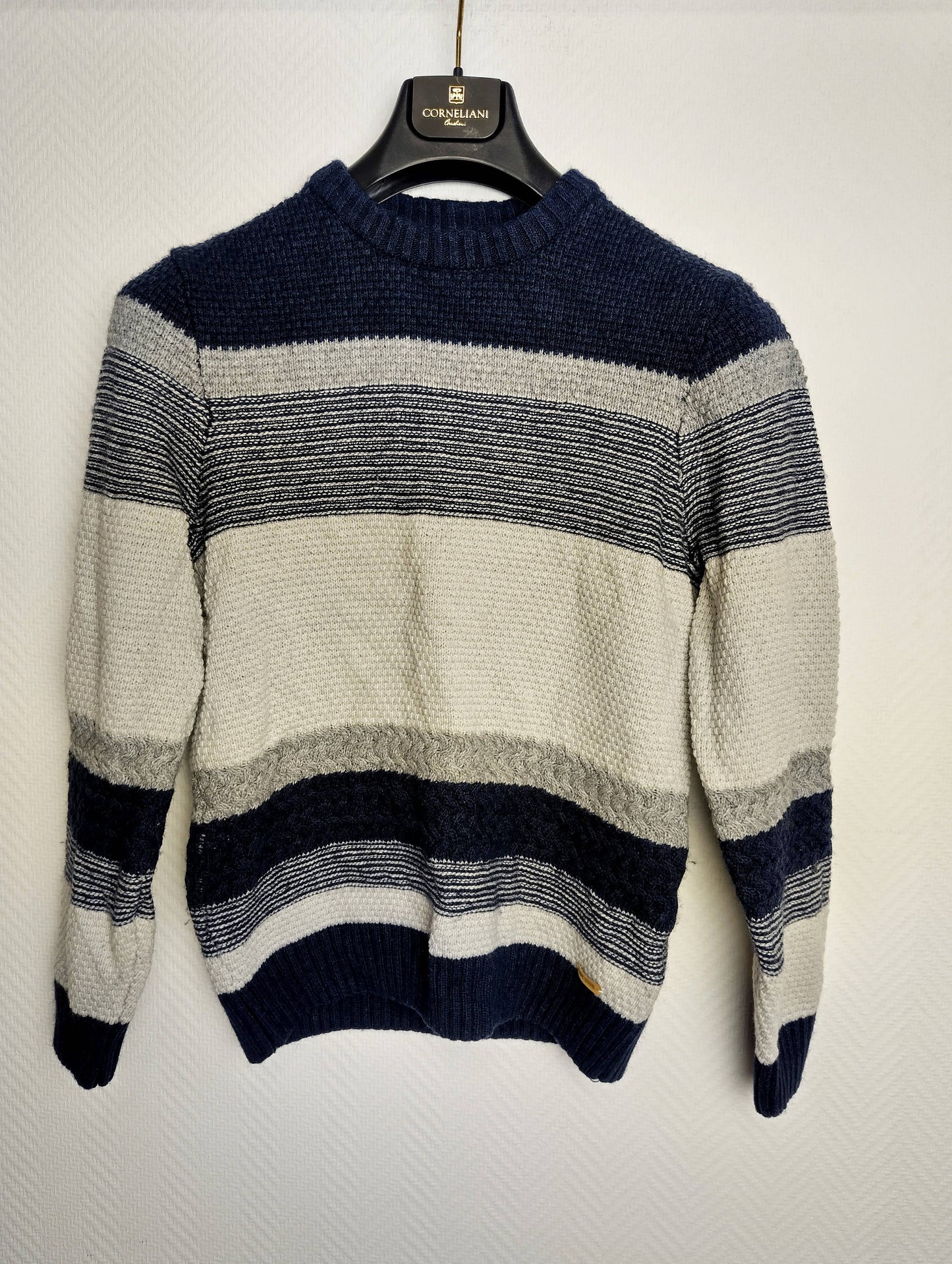 Front view of the striped knit sweater