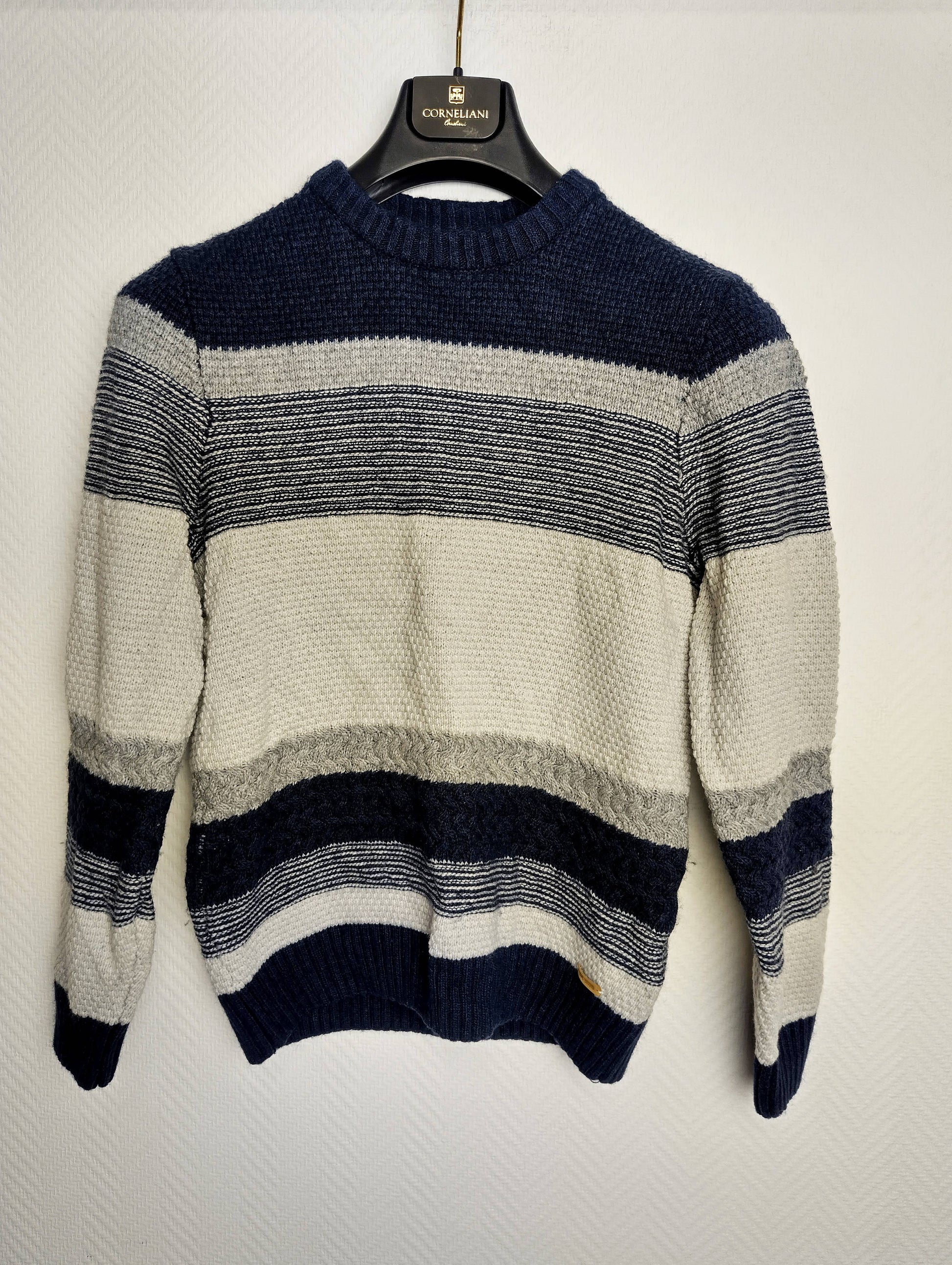 Front view of the striped knit sweater